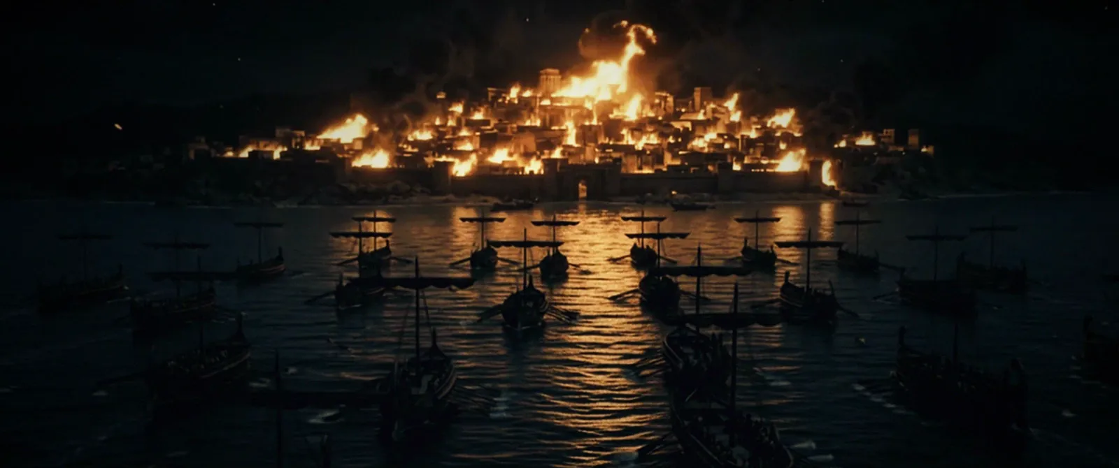 Troy burns across the water